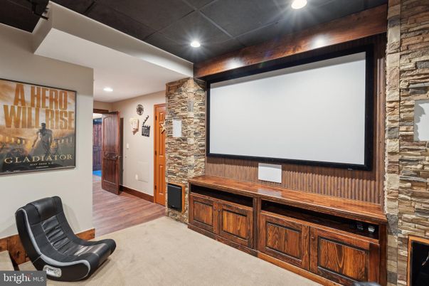 Interior, Projection Screen, Recessed Lighting, Stone Walls, Wood Texture Flooring