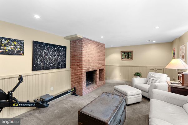 Fireplace, Fitness Equipment, Interior, Living room, Recessed Lighting, Stone Walls