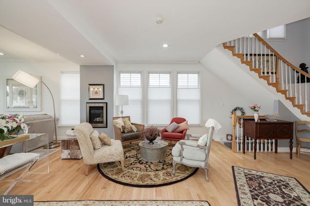 Dining room, Fireplace, Interior, Living room, Recessed Lighting, Wood Texture Flooring