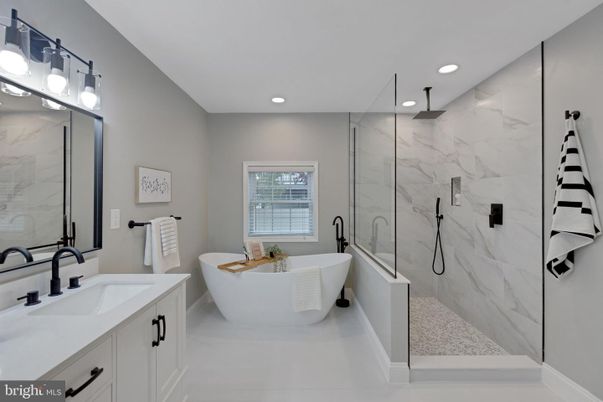 Bathroom, Dual Sink Vanities, Free Standing Baths, Glass Shower, Interior, Marble Walls, Recessed Lighting