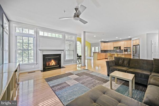 Fireplace, Interior, Kitchen, Living room, Recessed Lighting, Stainless Steel Appliances, Wood Texture Flooring