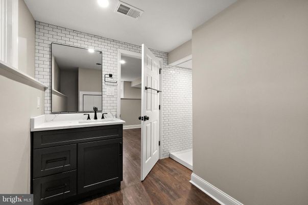 Bathroom, Dual Sink Vanities, Interior, Recessed Lighting, Wood Texture Flooring