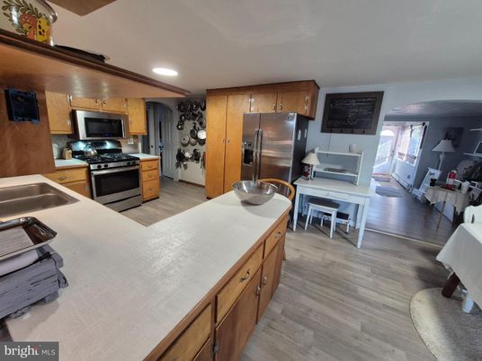 Dining room, Interior, Kitchen, Recessed Lighting, Stainless Steel Appliances, Wood Texture Flooring