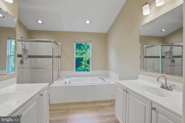 Bathroom, Dual Sink Vanities, Glass Shower, Interior, Recessed Lighting, Wood Texture Flooring