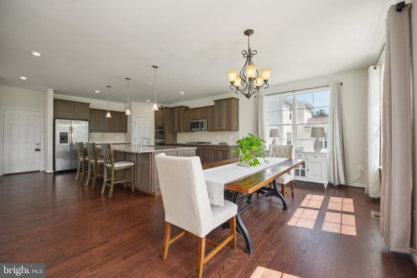 Chandelier, Dining room, Interior, Kitchen, Pendant Lights, Recessed Lighting, Stainless Steel Appliances, Wood Texture Flooring
