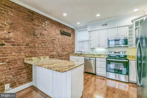 Interior, Kitchen, Recessed Lighting, Stainless Steel Appliances, Stone Walls, Wood Texture Flooring