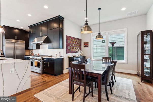 Dining room, Interior, Kitchen, Pendant Lights, Recessed Lighting, Stainless Steel Appliances, Wood Texture Flooring