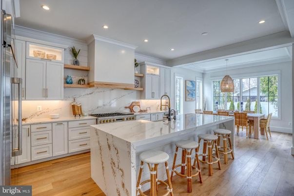 Interior, Kitchen, Marble Walls, Pendant Lights, Recessed Lighting, Stainless Steel Appliances, Wood Texture Flooring