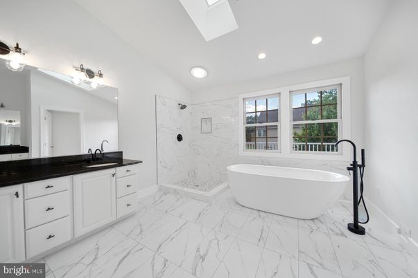 Bathroom, Dual Sink Vanities, Free Standing Baths, Interior, Marble, Marble Walls, Recessed Lighting