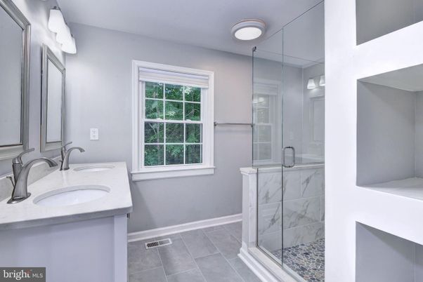 Bathroom, Dual Sink Vanities, Glass Shower, Interior, Marble Walls