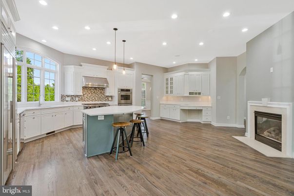 Fireplace, Interior, Kitchen, Pendant Lights, Recessed Lighting, Stainless Steel Appliances, Wood Texture Flooring