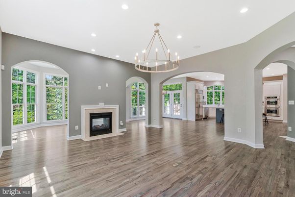 Chandelier, Empty room, Fireplace, Interior, Kitchen, Pendant Lights, Recessed Lighting, Wood Texture Flooring