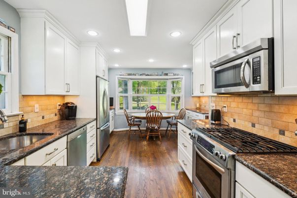 Dining room, Interior, Kitchen, Recessed Lighting, Stainless Steel Appliances, Wood Texture Flooring