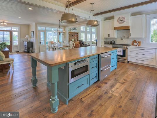 Chandelier, Dining room, Interior, Kitchen, Living room, Pendant Lights, Recessed Lighting, Stainless Steel Appliances, Wood Texture Flooring