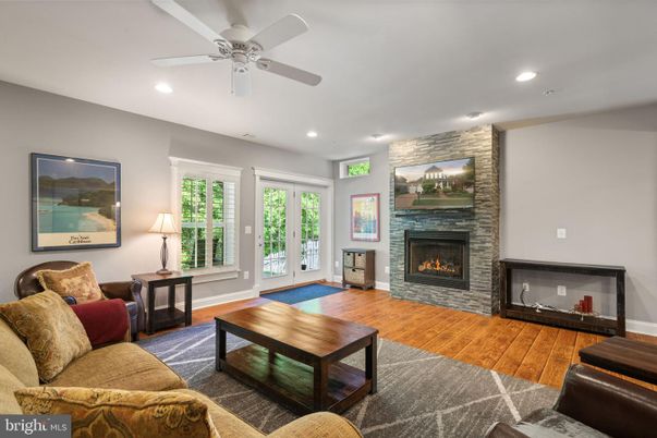 Fireplace, Interior, Living room, Recessed Lighting, Stone Walls, Wood Texture Flooring