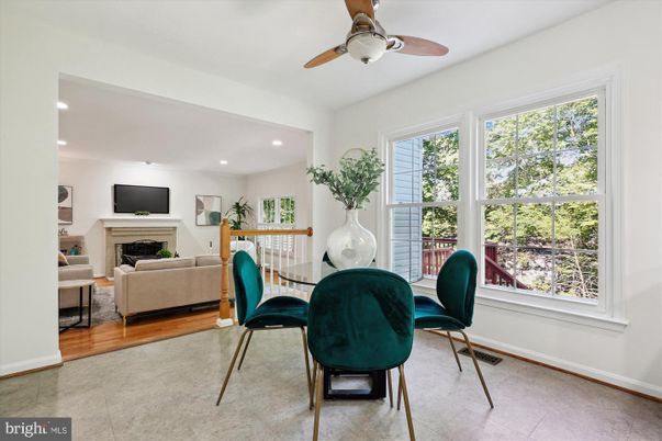 Dining room, Fireplace, Interior, Living room, Recessed Lighting, Wood Texture Flooring