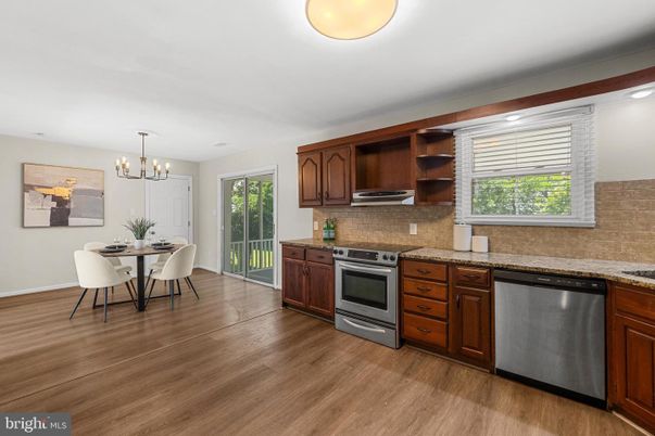 Chandelier, Dining room, Interior, Kitchen, Recessed Lighting, Stainless Steel Appliances, Wood Texture Flooring