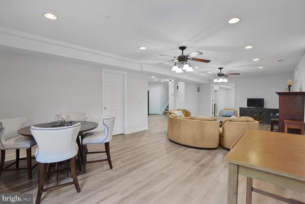 Dining room, Fireplace, Interior, Living room, Recessed Lighting, Wood Texture Flooring