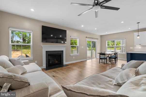 Dining room, Fireplace, Interior, Living room, Pendant Lights, Recessed Lighting, Wood Texture Flooring