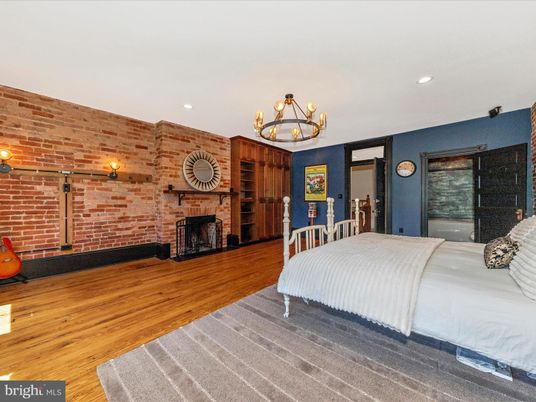 Bedroom, Chandelier, Fireplace, Interior, Recessed Lighting, Stone Walls, Wood Texture Flooring