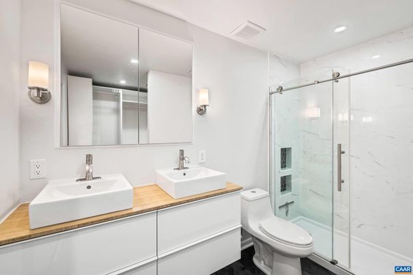 Bathroom, Dual Sink Vanities, Glass Shower, Interior, Marble Walls, Recessed Lighting