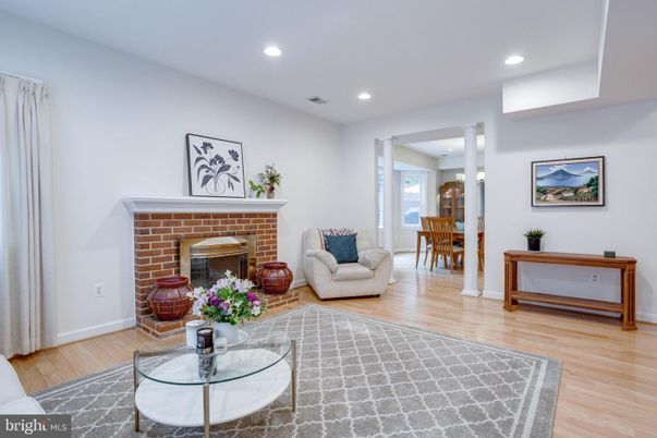 Dining room, Fireplace, Interior, Living room, Recessed Lighting, Wood Texture Flooring