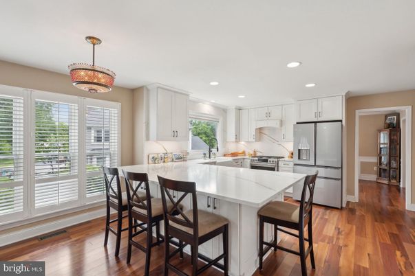 Chandelier, Dining room, Interior, Kitchen, Recessed Lighting, Stainless Steel Appliances, Wood Texture Flooring