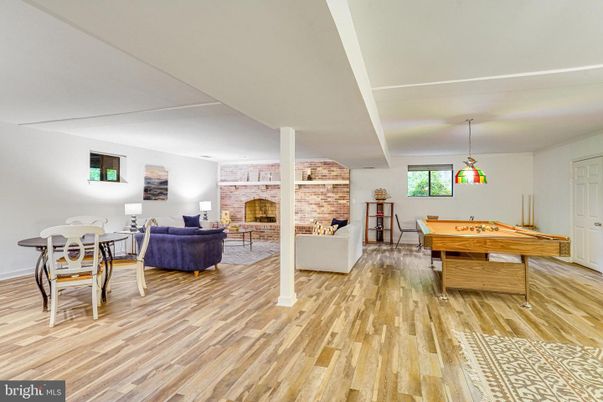 Billiard Table, Fireplace, Game Room, Interior, Living room, Pendant Lights, Stone Walls, Wood Texture Flooring