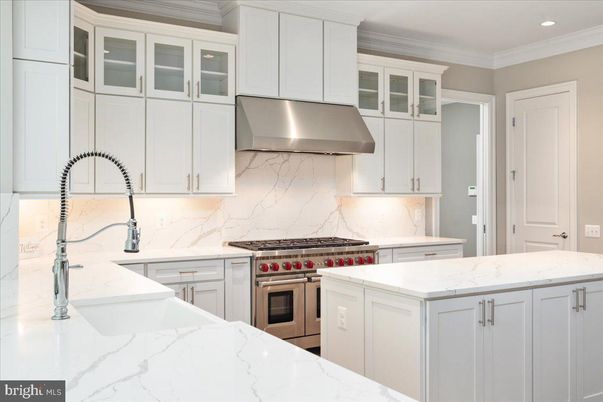 Interior, Kitchen, Marble Walls, Recessed Lighting, Stainless Steel Appliances