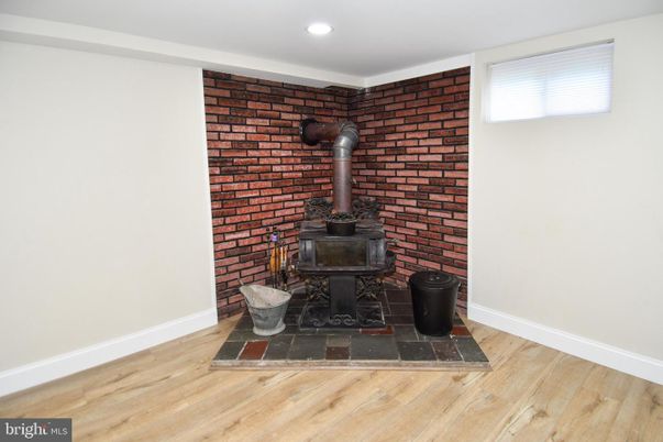 Fireplace, Interior, Recessed Lighting, Stone Walls, Wood Texture Flooring