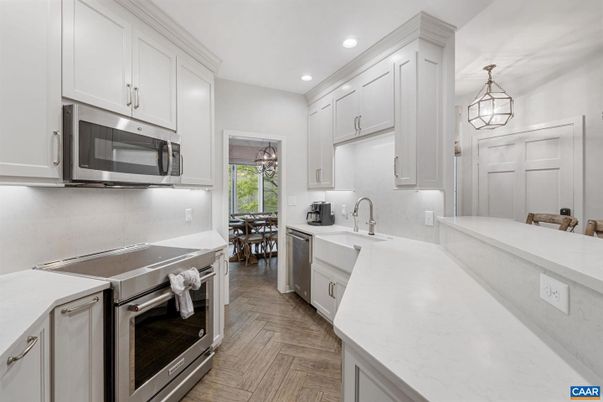 Dining room, Interior, Kitchen, Pendant Lights, Recessed Lighting, Stainless Steel Appliances, Wood Texture Flooring
