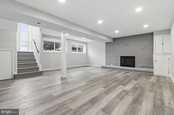 Empty room, Fireplace, Interior, Recessed Lighting, Stone Walls, Wood Texture Flooring