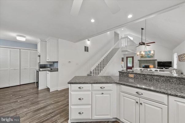 Fireplace, Interior, Kitchen, Recessed Lighting, Wood Texture Flooring