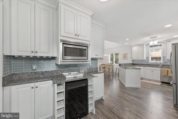 Dining room, Interior, Kitchen, Recessed Lighting, Stainless Steel Appliances, Wood Texture Flooring