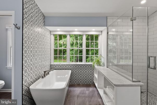 Bathroom, Free Standing Baths, Glass Shower, Interior, Recessed Lighting, Wood Texture Flooring