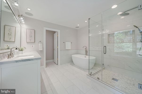 Bathroom, Dual Sink Vanities, Free Standing Baths, Glass Shower, Interior, Marble, Marble Walls, Recessed Lighting