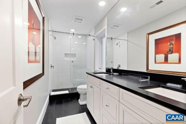 Bathroom, Dual Sink Vanities, Glass Shower, Interior, Recessed Lighting, Wood Texture Flooring