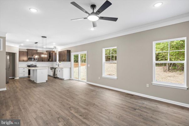 Empty room, Interior, Kitchen, Pendant Lights, Recessed Lighting, Stainless Steel Appliances, Wood Texture Flooring