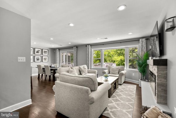 Dining room, Fireplace, Interior, Living room, Recessed Lighting, Wood Texture Flooring