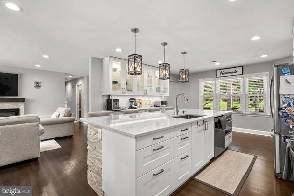 Fireplace, Interior, Kitchen, Living room, Pendant Lights, Recessed Lighting, Stainless Steel Appliances, Wood Texture Flooring