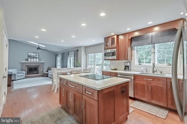 Dining room, Fireplace, Interior, Kitchen, Living room, Pendant Lights, Recessed Lighting, Stainless Steel Appliances, Wood Texture Flooring