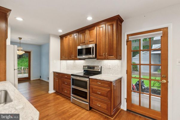 Chandelier, Interior, Kitchen, Recessed Lighting, Stainless Steel Appliances, Wood Texture Flooring