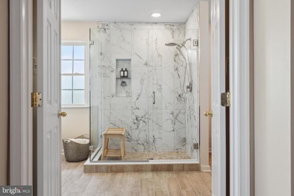 Bathroom, Glass Shower, Interior, Marble Walls, Recessed Lighting, Wood Texture Flooring