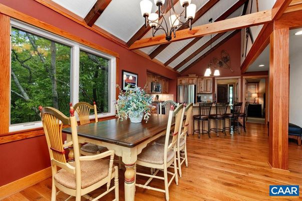 Chandelier, Dining room, Interior, Kitchen, Recessed Lighting, Stainless Steel Appliances, Wooden Beams, Wood Texture Flooring