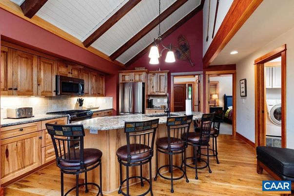 Interior, Kitchen, Pendant Lights, Recessed Lighting, Stainless Steel Appliances, Washer, Wooden Beams, Wood Texture Flooring