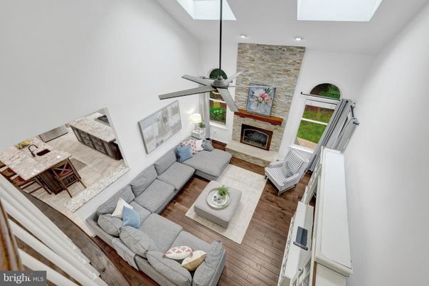 Fireplace, Interior, Living room, Recessed Lighting, Stone Walls, Wood Texture Flooring