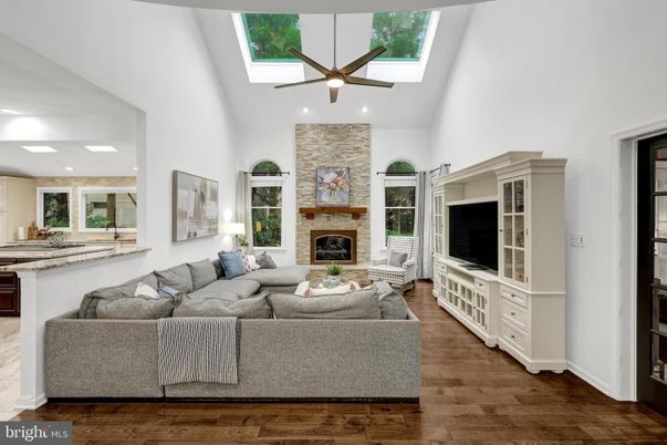Fireplace, Interior, Living room, Recessed Lighting, Stone Walls, Wood Texture Flooring