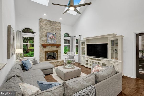 Fireplace, Interior, Living room, Recessed Lighting, Stone Walls, Wood Texture Flooring