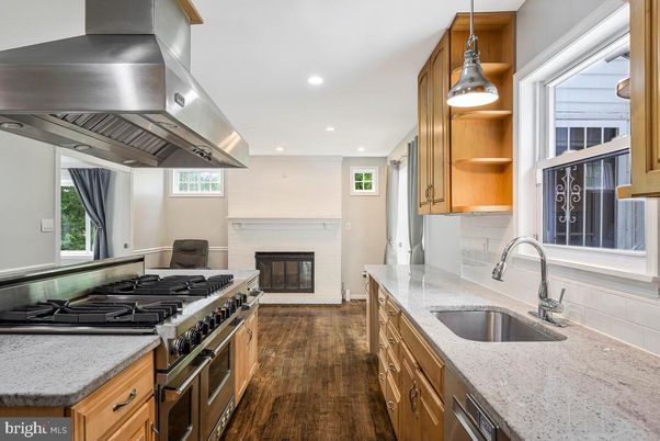 Fireplace, Interior, Kitchen, Pendant Lights, Recessed Lighting, Stainless Steel Appliances, Wood Texture Flooring