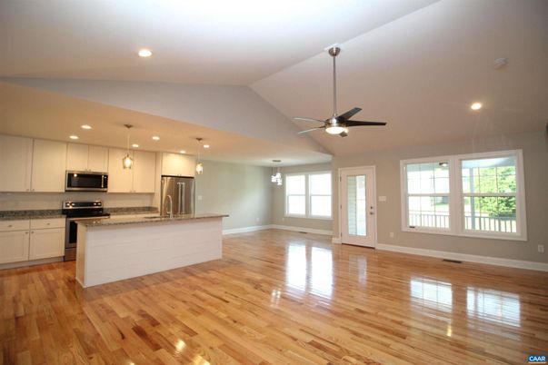 Empty room, Interior, Kitchen, Pendant Lights, Recessed Lighting, Stainless Steel Appliances, Wood Texture Flooring